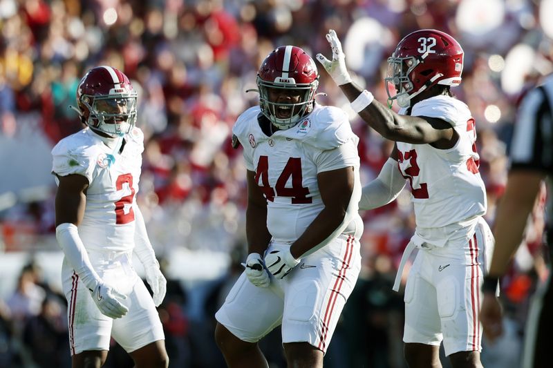 Jan 1, 2024; Pasadena, CA, USA; Alabama Crimson Tide defensive lineman Damon Payne Jr. (44) and linebacker Deontae Lawson (32) reacts after a play in the first quarter against the Michigan Wolverines in the 2024 Rose Bowl college football playoff semifinal game at Rose Bowl. Mandatory Credit: Kiyoshi Mio-USA TODAY Sports