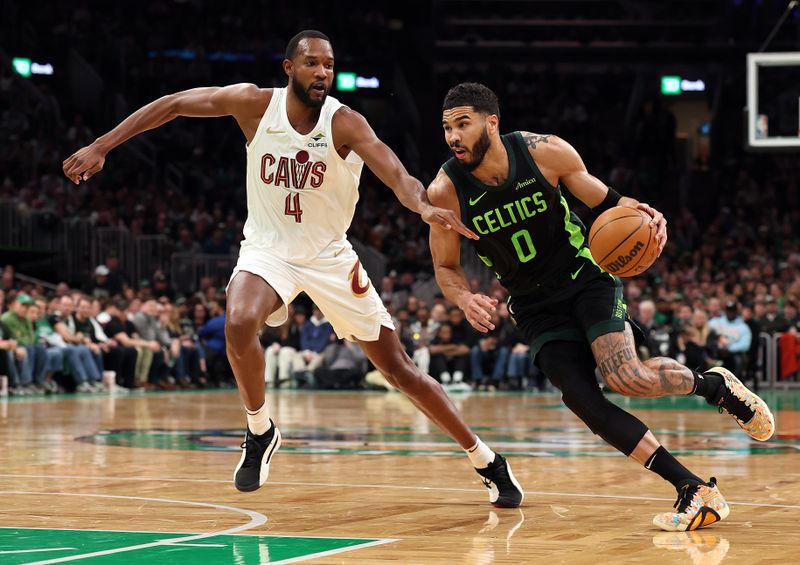 BOSTON, MASSACHUSETTS - FEBRUARY 28: Jayson Tatum #0 of the Boston Celtics drives past Evan Mobley #4 of the Cleveland Cavaliers during the first quarter at TD Garden on February 28, 2025 in Boston, Massachusetts. NOTE TO USER: User expressly acknowledges and agrees that, by downloading and or using this photograph, User is consenting to the terms and conditions of the Getty Images License Agreement.  (Photo by Maddie Meyer/Getty Images)