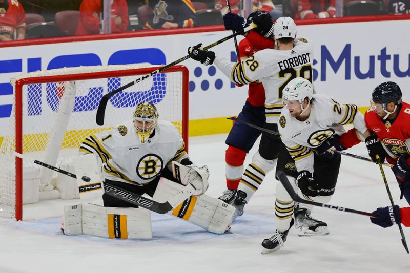 May 6, 2024; Sunrise, Florida, USA; Boston Bruins goaltender Jeremy Swayman (1) makes a save against the Florida Panthers during the third period in game one of the second round of the 2024 Stanley Cup Playoffs at Amerant Bank Arena. Mandatory Credit: Sam Navarro-USA TODAY Sports