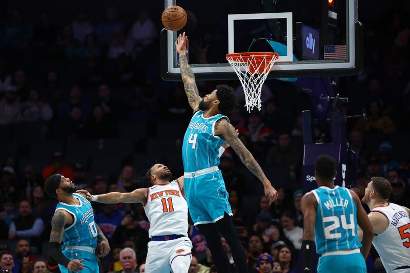 CHARLOTTE, NORTH CAROLINA - JANUARY 29: Nick Richards #4 of the Charlotte Hornets blocks a shot attempt from Jalen Brunson #11 of the New York Knicks during the first half of the game at Spectrum Center on January 29, 2024 in Charlotte, North Carolina. NOTE TO USER: User expressly acknowledges and agrees that, by downloading and or using this photograph, User is consenting to the terms and conditions of the Getty Images License Agreement. (Photo by Jared C. Tilton/Getty Images)