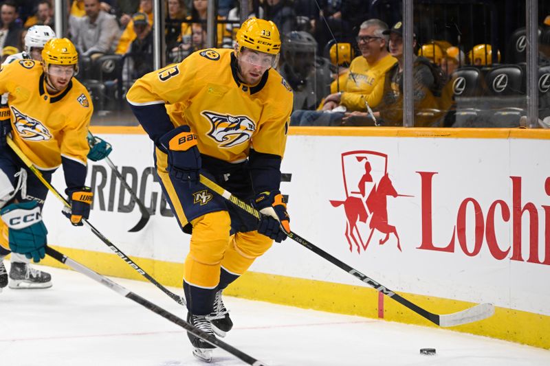 Oct 21, 2023; Nashville, Tennessee, USA; Nashville Predators center Yakov Trenin (13) skates against the San Jose Sharks during the first period at Bridgestone Arena. Mandatory Credit: Steve Roberts-USA TODAY Sports