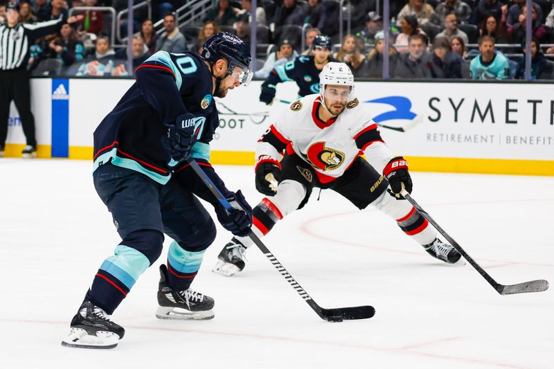 Jan 4, 2024; Seattle, Washington, USA; Seattle Kraken left wing Tomas Tatar (90) skates with the puck against Ottawa Senators defenseman Artem Zub (2) during the second period at Climate Pledge Arena. Mandatory Credit: Joe Nicholson-USA TODAY Sports