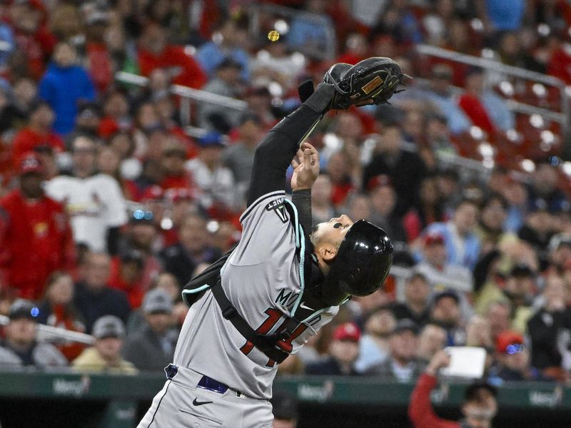 Apr 22, 2024; St. Louis, Missouri, USA;  Arizona Diamondbacks catcher Gabriel Moreno (14) catches a fly ball against the St. Louis Cardinals during the seventh inning at Busch Stadium. Mandatory Credit: Jeff Curry-USA TODAY Sports