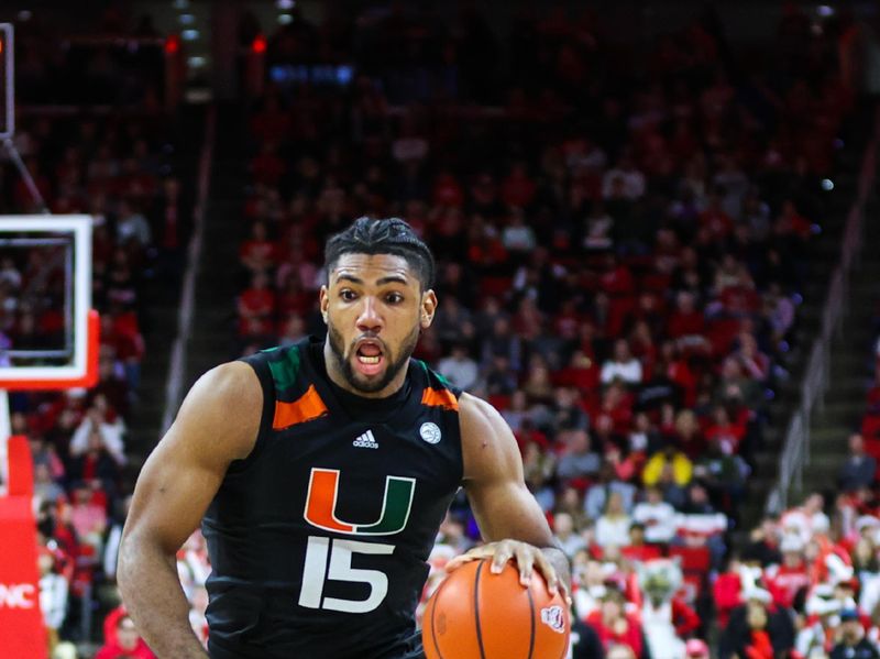 Jan 14, 2023; Raleigh, North Carolina, USA; Miami Hurricanes forward Norchad Omier (15) breaks away during the second half against North Carolina State Wolfpack at PNC Arena. Mandatory Credit: Jaylynn Nash-USA TODAY Sports