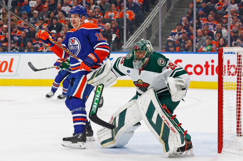 Dec 8, 2023; Edmonton, Alberta, CAN; Edmonton Oilers forward Zach Hyman (18) tries to screen Minnesota Wild goaltender Marc-Andre Fleury (29) during the first period at Rogers Place. Mandatory Credit: Perry Nelson-USA TODAY Sports