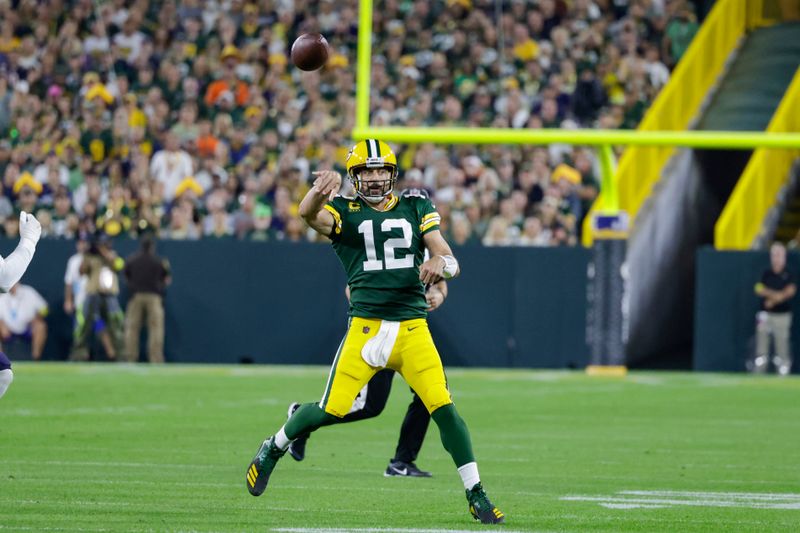 Green Bay Packers quarterback Aaron Rodgers scrambles against the Chicago Bears during an NFL football game Sunday, Sept. 18, 2022, in Green Bay, Wis. (AP Photo/Matt Ludtke)