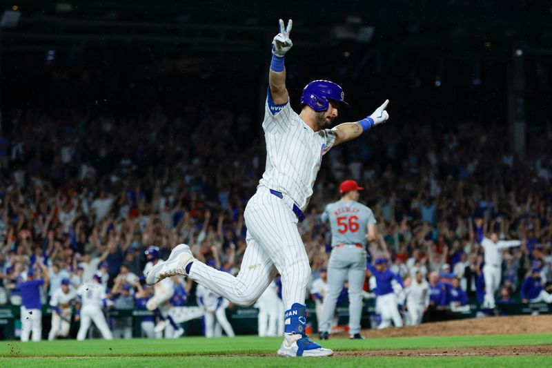 Aug 1, 2024; Chicago, Illinois, USA; Chicago Cubs outfielder Mike Tauchman (40) celebrates his walk-off single against the St. Louis Cardinals during the ninth inning at Wrigley Field. Mandatory Credit: Kamil Krzaczynski-USA TODAY Sports