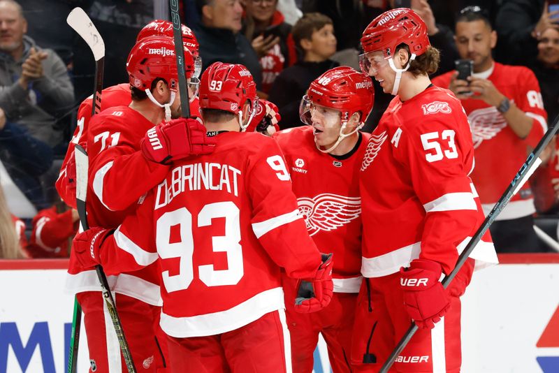 Oct 15, 2025; Detroit, Michigan, USA;  Detroit Red Wings right wing Patrick Kane (88) receives congratulations from teammates after he scores in the second period against the Florida Panthers at Little Caesars Arena. Mandatory Credit: Rick Osentoski-Imagn Images
