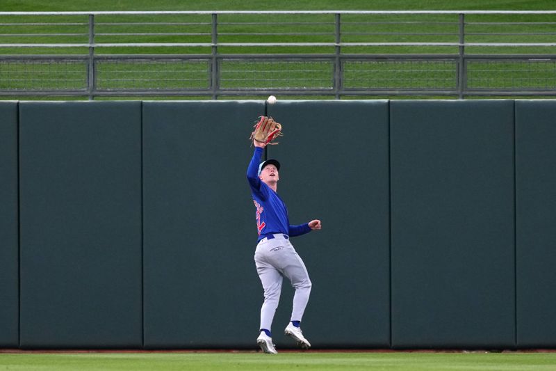 Mar 5, 2024; Surprise, Arizona, USA; Chicago Cubs center fielder Pete Crow-Armstrong (52) catches a fly ball against the Kansas City Royals during the second inning at Surprise Stadium. Mandatory Credit: Joe Camporeale-USA TODAY Sports