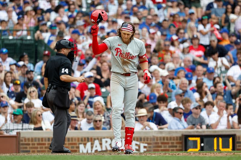 Jul 4, 2024; Chicago, Illinois, USA; Philadelphia Phillies third baseman Alec Bohm (28) reacts after striking out against the Chicago Cubs during the eighth inning at Wrigley Field. Mandatory Credit: Kamil Krzaczynski-USA TODAY Sports