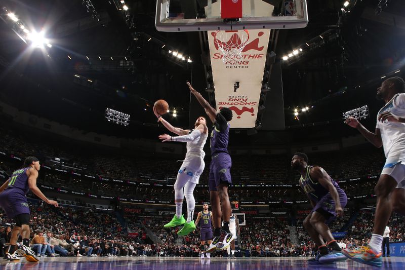 NEW ORLEANS, LA - JANUARY 7: Donte DiVincenzo #0 of the Minnesota Timberwolves drives to the basket during the game against the New Orleans Pelicans on January 7, 2025 at the Smoothie King Center in New Orleans, Louisiana. NOTE TO USER: User expressly acknowledges and agrees that, by downloading and or using this Photograph, user is consenting to the terms and conditions of the Getty Images License Agreement. Mandatory Copyright Notice: Copyright 2025 NBAE(Photo by Layne Murdoch Jr./NBAE via Getty Images)