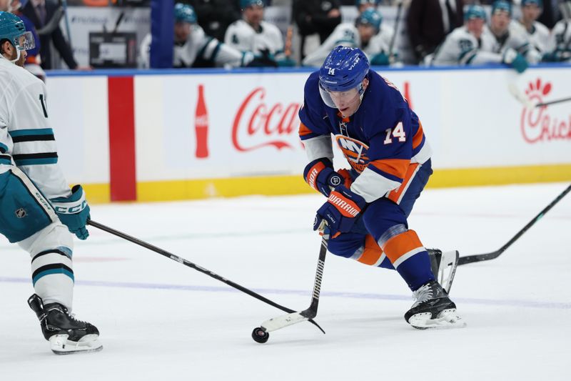 Jan 18, 2025; Elmont, New York, USA; New York Islanders center Bo Horvat (14) skates with the puck against the San Jose Sharks during the second period at UBS Arena. Mandatory Credit: Thomas Salus-Imagn Images