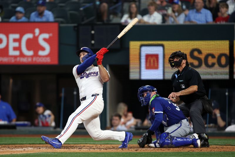 Jun 22, 2024; Arlington, Texas, USA; Texas Rangers left fielder Wyatt Langford (36) hits a grand slam home run in the eighth inning against the Kansas City Royals at Globe Life Field. Mandatory Credit: Tim Heitman-USA TODAY Sports