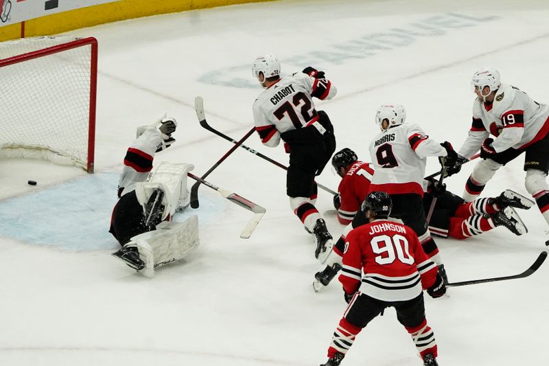 Feb 17, 2024; Chicago, Illinois, USA; Chicago Blackhawks center Jason Dickinson (16) scores the game winning goal on Ottawa Senators goaltender Joonas Korpisalo (70) during the third period at United Center. Mandatory Credit: David Banks-USA TODAY Sports