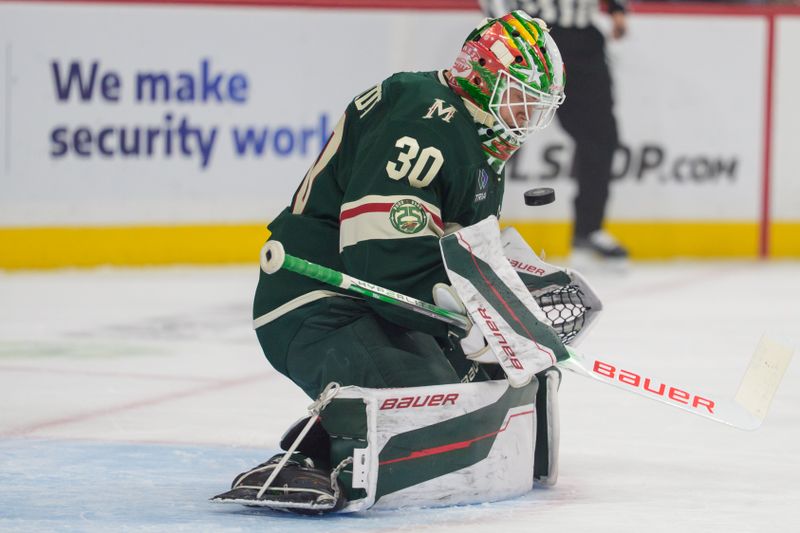 Oct 13, 2025; Saint Paul, Minnesota, USA; Minnesota Wild goaltender Jesper Wallstedt (30) stops a Los Angeles Kings shot in the first period at Grand Casino Arena. Mandatory Credit: Matt Blewett-Imagn Images