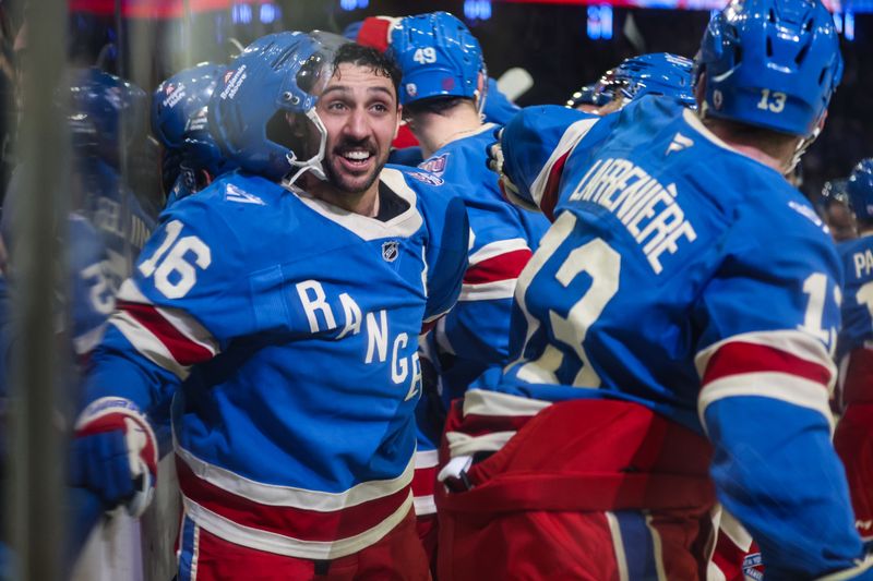 Dec 13, 2025; New York, New York, USA;  New York Rangers center Vincent Trocheck (16) celebrates with left wing Alexis Lafrenière (13) after defeating the Montréal Canadiens 5-4 in overtime at Madison Square Garden. Mandatory Credit: Wendell Cruz-Imagn Images
