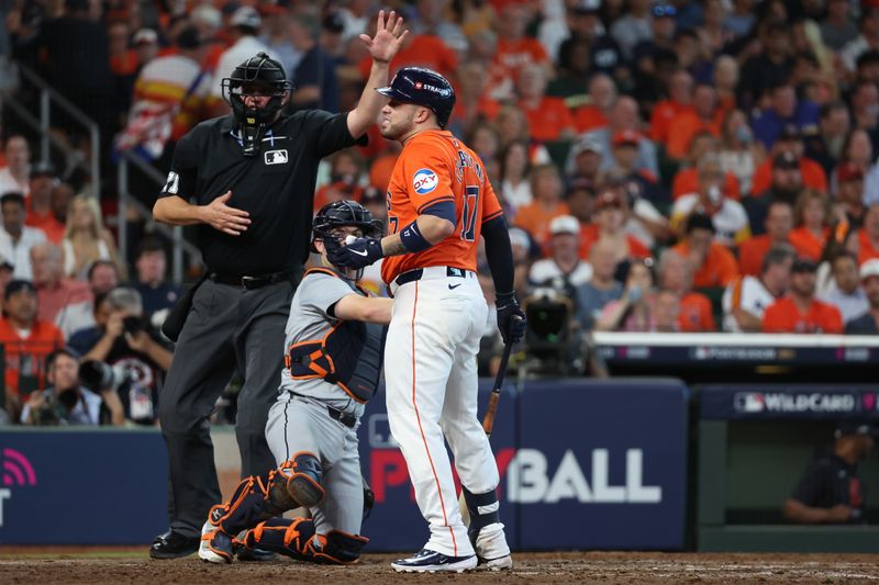 Oct 2, 2024; Houston, Texas, USA; Houston Astros catcher Victor Caratini (17) Reacts after being hit by a pitch against the Detroit Tigers during the seventh inning of game two of the Wildcard round for the 2024 MLB Playoffs at Minute Maid Park. Mandatory Credit: Thomas Shea-Imagn Images