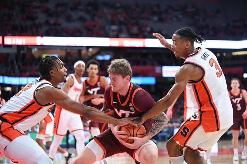 Feb 27, 2024; Syracuse, New York, USA; Virginia Tech Hokies guard Tyler Nickel is pressed between Syracuse Orange guard JJ Starling (2) and guard Judah Mintz (3) in the first half at the JMA Wireless Dome. Mandatory Credit: Mark Konezny-USA TODAY Sports