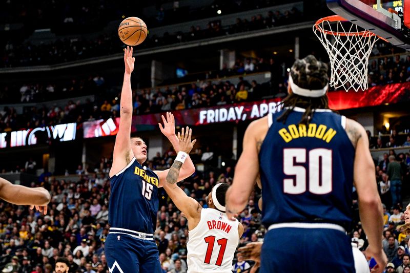 DENVER, COLORADO - MARCH 11: Nikola Jokic #15 of the Denver Nuggets shoots and scores in the first half against the Toronto Raptors at Ball Arena on March 11, 2024 in Denver, Colorado. NOTE TO USER: User expressly acknowledges and agrees that, by downloading and or using this photograph, User is consenting to the terms and conditions of the Getty Images License Agreement.  (Photo by Dustin Bradford/Getty Images)