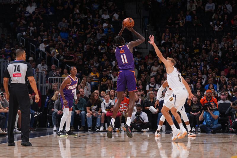 DENVER, CO - OCTOBER 13: Bol Bol #11 of the Phoenix Suns shoots a three point basket during the game against the Denver Nuggets on October 13, 2024 at Ball Arena in Denver, Colorado. NOTE TO USER: User expressly acknowledges and agrees that, by downloading and/or using this Photograph, user is consenting to the terms and conditions of the Getty Images License Agreement. Mandatory Copyright Notice: Copyright 2024 NBAE (Photo by Bart Young/NBAE via Getty Images)