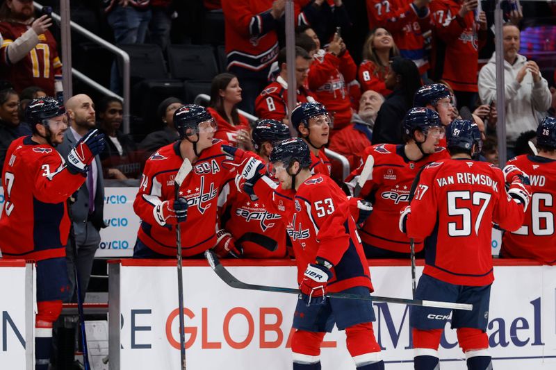 Jan 14, 2025; Washington, District of Columbia, USA; Washington Capitals center Ethen Frank (53) celebrates with teammates after scoring a goal against the Anaheim Ducks in the second period at Capital One Arena. Mandatory Credit: Geoff Burke-Imagn Images