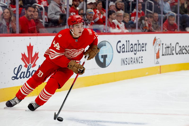 Oct 9, 2025; Detroit, Michigan, USA;  Detroit Red Wings defenseman Axel Sandin-Pellikka (44) skates with the puck in the first period against the Montréal Canadiens at Little Caesars Arena. Mandatory Credit: Rick Osentoski-Imagn Images