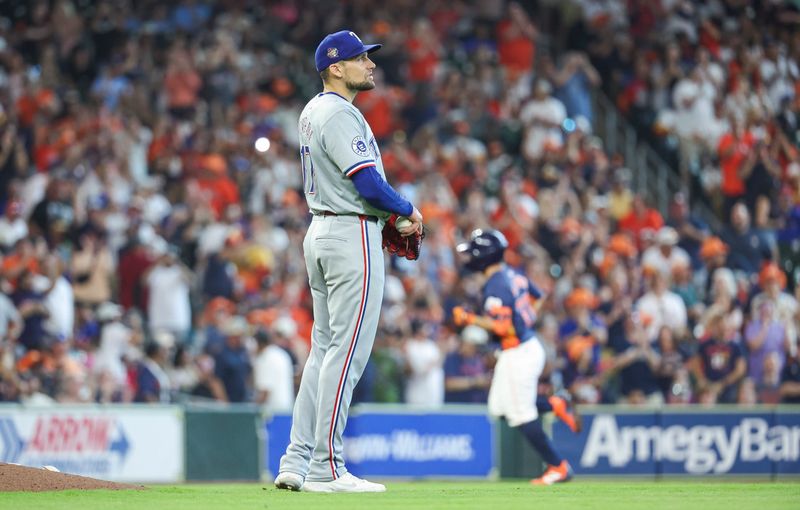 Apr 14, 2024; Houston, Texas, USA; Texas Rangers pitcher Nathan Eovaldi (17) reacts and Houston Astros second baseman Jose Altuve (27) rounds the bases after hitting a home run during the third inning at Minute Maid Park. Mandatory Credit: Troy Taormina-USA TODAY Sports