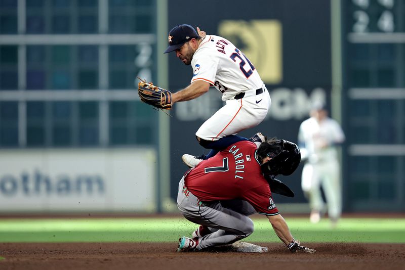 Sep 7, 2024; Houston, Texas, USA; Arizona Diamondbacks right fielder Corbin Carroll (7) runs into Houston Astros second baseman Jose Altuve (27) while sliding into second base during the fifth inning at Minute Maid Park. Mandatory Credit: Erik Williams-Imagn Images
