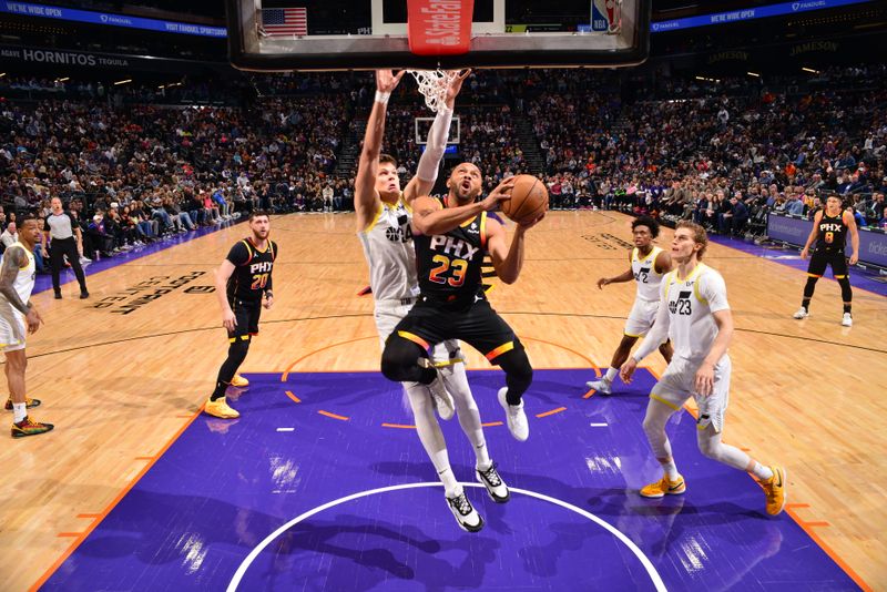 PHOENIX, AZ - FEBRUARY 8: Eric Gordon #23 of the Phoenix Suns drives to the basket during the game against the Utah Jazz on February 8, 2024 at Footprint Center in Phoenix, Arizona. NOTE TO USER: User expressly acknowledges and agrees that, by downloading and or using this photograph, user is consenting to the terms and conditions of the Getty Images License Agreement. Mandatory Copyright Notice: Copyright 2024 NBAE (Photo by Barry Gossage/NBAE via Getty Images)