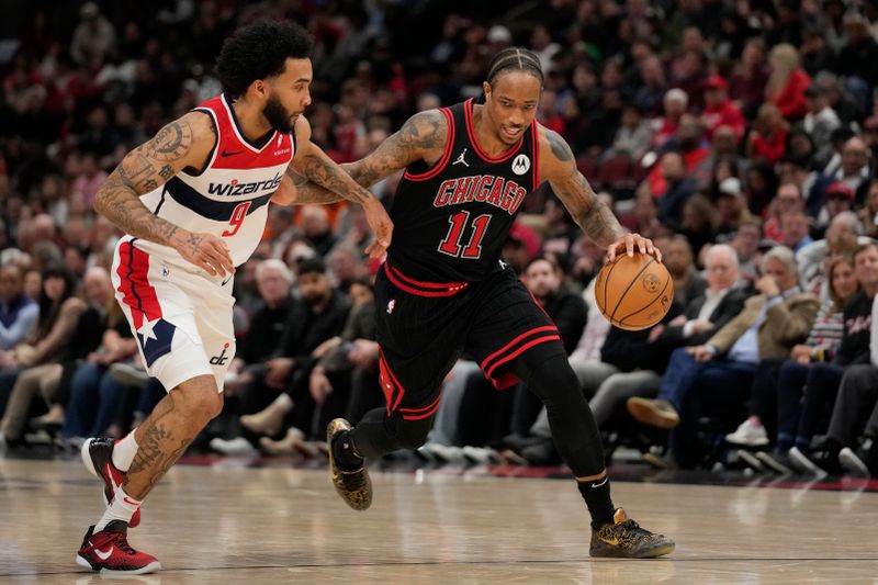 CHICAGO, ILLINOIS - MARCH 25: DeMar DeRozan #11 of the Chicago Bulls dribbles the ball against Justin Champagnie #9 of the Washington Wizards during the second half at the United Center on March 25, 2024 in Chicago, Illinois. NOTE TO USER: User expressly acknowledges and agrees that, by downloading and or using this photograph, User is consenting to the terms and conditions of the Getty Images License Agreement. (Photo by Patrick McDermott/Getty Images)