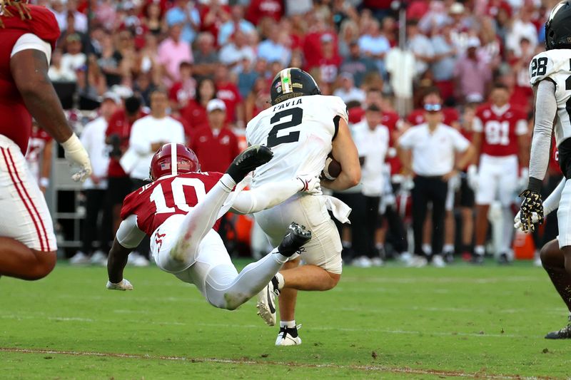 Oct 4, 2025; Tuscaloosa, Alabama, USA; Vanderbilt Commodores quarterback Diego Pavia (2) is sacked by Alabama Crimson Tide linebacker Justin Jefferson (10) during the second half at Saban Field at Bryant-Denny Stadium. Mandatory Credit: David Leong-Imagn Images