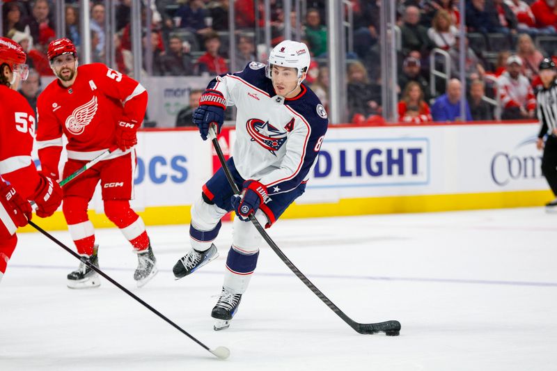 Mar 19, 2024; Detroit, Michigan, USA; Columbus Blue Jackets defenseman Zach Werenski (8) handles the puck during the first period of the game against the Detroit Red Wings at Little Caesars Arena. Mandatory Credit: Brian Bradshaw Sevald-USA TODAY Sports