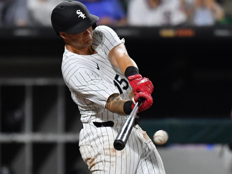 Jul 30, 2024; Chicago, Illinois, USA; Chicago White Sox third base Nick Senzel (15) singles during the seventh inning against the Kansas City Royals at Guaranteed Rate Field. Mandatory Credit: Patrick Gorski-USA TODAY Sports