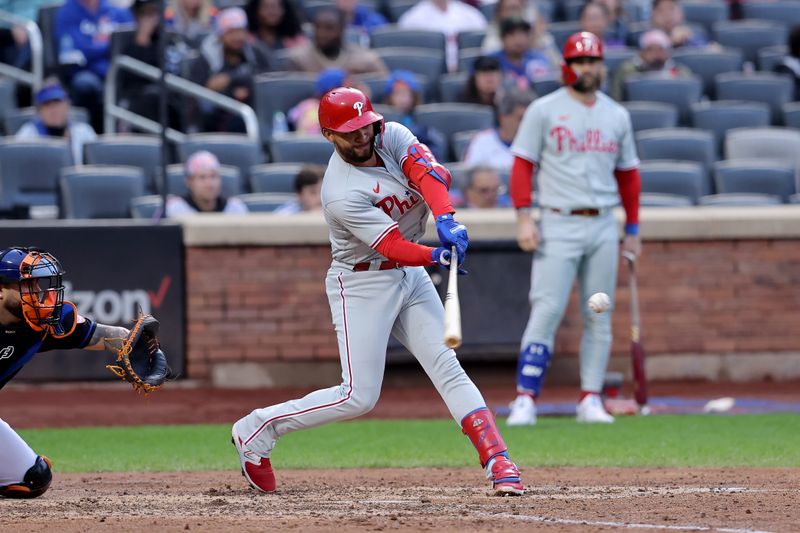 Sep 30, 2023; New York City, New York, USA; Philadelphia Phillies shortstop Edmundo Sosa (33) hits an RBI single against the New York Mets during the eighth inning at Citi Field. Mandatory Credit: Brad Penner-USA TODAY Sports