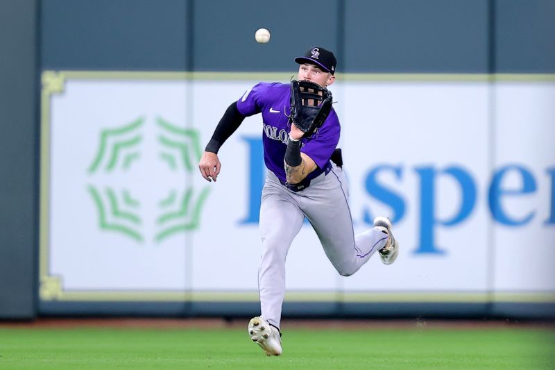 Jun 26, 2024; Houston, Texas, USA; Colorado Rockies center fielder Brenton Doyle (9) catches a fly ball for an out against the Houston Astros during the fifth inning at Minute Maid Park. Mandatory Credit: Erik Williams-USA TODAY Sports