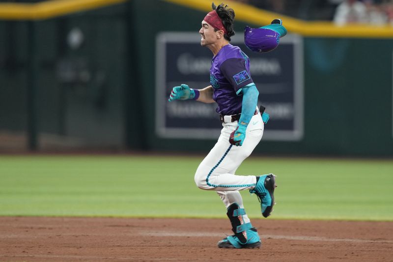 May 10, 2025; Phoenix, Arizona, USA; Arizona Diamondbacks outfielder Corbin Carroll (7) runs to third base en route to a triple against the Los Angeles Dodgers during the third inning at Chase Field. Mandatory Credit: Joe Camporeale-Imagn Images