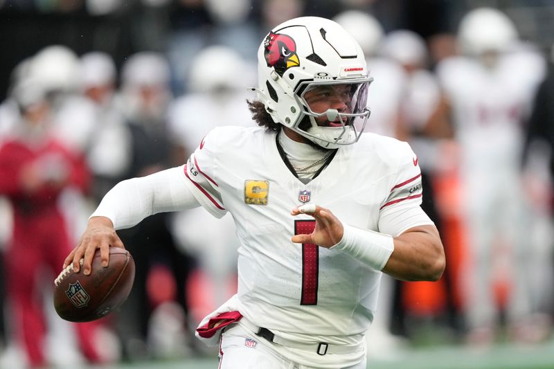 Arizona Cardinals quarterback Kyler Murray (1) looks to pass during the first half of an NFL football game against the Seattle Seahawks, Sunday, Nov. 24, 2024, in Seattle. (AP Photo/Stephen Brashear)