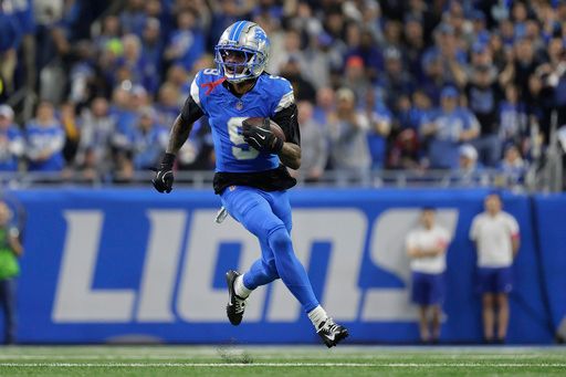 Detroit Lions wide receiver Jameson Williams (9) runs for a 61-yard touchdown against the Washington Commanders during the first half of an NFL football divisional playoff game, Saturday, Jan. 18, 2025, in Detroit. (AP Photo/Rey Del Rio)