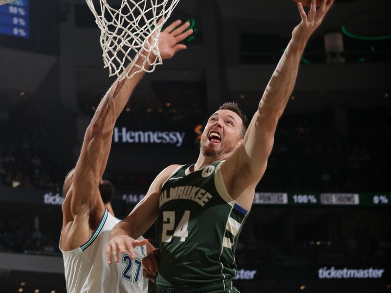 MILWAUKEE, WI - FEBRUARY 8: Pat Connaughton #24 of the Milwaukee Bucks shoots the ball during the game against the Minnesota Timberwolves on February 8, 2024 at the Fiserv Forum Center in Milwaukee, Wisconsin. NOTE TO USER: User expressly acknowledges and agrees that, by downloading and or using this Photograph, user is consenting to the terms and conditions of the Getty Images License Agreement. Mandatory Copyright Notice: Copyright 2024 NBAE (Photo by Gary Dineen/NBAE via Getty Images).