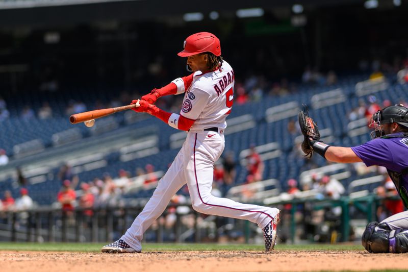 Jul 26, 2023; Washington, District of Columbia, USA; Washington Nationals shortstop CJ Abrams (5) hits a walk-off single during the ninth inning against the Colorado Rockies at Nationals Park. Mandatory Credit: Reggie Hildred-USA TODAY Sports