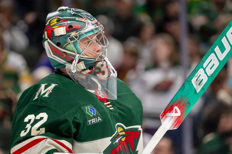 Nov 25, 2024; Saint Paul, Minnesota, USA;  Minnesota Wild goalie Filip Gustavsson (32) looks on against the Winnipeg Jets during the third period at Xcel Energy Center. Mandatory Credit: Nick Wosika-Imagn Images