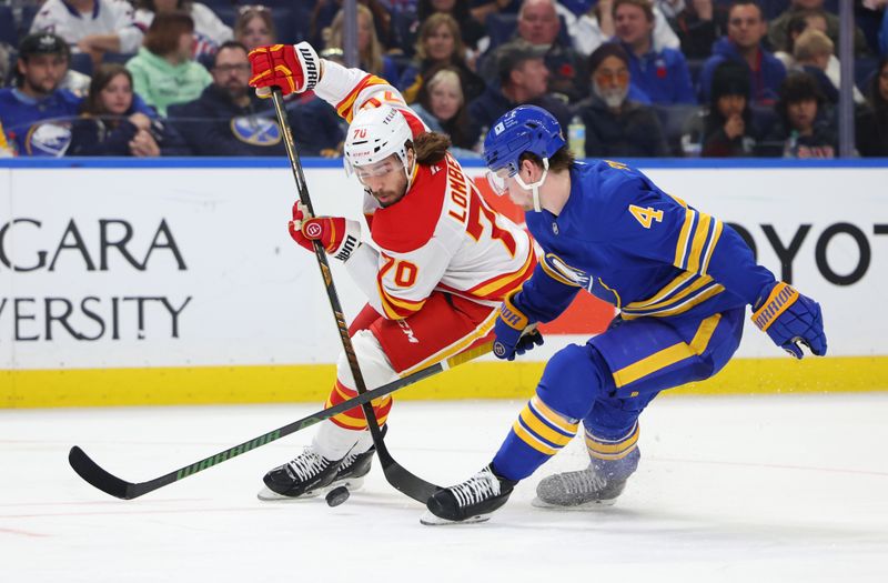 Nov 9, 2024; Buffalo, New York, USA;  Calgary Flames left wing Ryan Lomberg (70) and Buffalo Sabres defenseman Bowen Byram (4) go after a loose puck during the third period at KeyBank Center. Mandatory Credit: Timothy T. Ludwig-Imagn Images