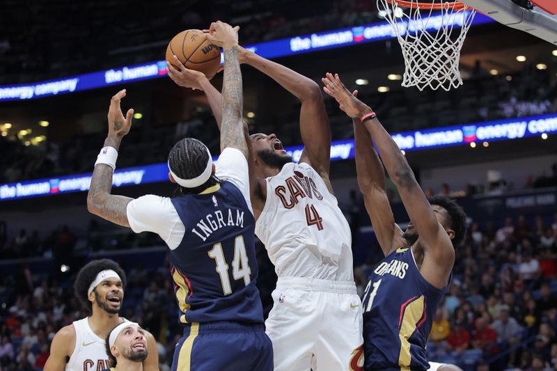 NEW ORLEANS, LOUISIANA - NOVEMBER 06: Evan Mobley #4 of the Cleveland Cavaliers shoots against Brandon Ingram #14 and Yves Missi #21 of the New Orleans Pelicans during the second half at the Smoothie King Center on November 06, 2024 in New Orleans, Louisiana. NOTE TO USER: User expressly acknowledges and agrees that, by downloading and or using this Photograph, user is consenting to the terms and conditions of the Getty Images License Agreement. (Photo by Jonathan Bachman/Getty Images)