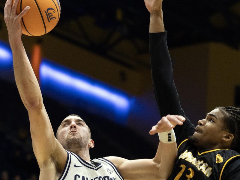 Dec 9, 2025; Berkeley, California, USA; California Golden Bears forward John Camden (2) goes up for a shot against Dominican Penguins Stephen Ransom (23) during the first half at Haas Pavilion. Mandatory Credit: D. Ross Cameron-Imagn Images