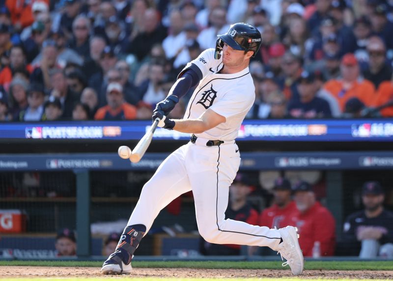 Oct 9, 2024; Detroit, Michigan, USA;  Detroit Tigers second baseman Colt Keith (33) hits a single against the Cleveland Guardians in the sixth inning in game three of the ALDS for the 2024 MLB Playoffs at Comerica Park. Mandatory Credit: David Reginek-Imagn Images