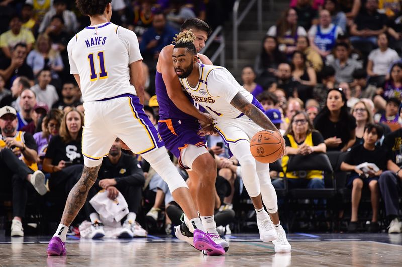 LOS ANGELES, CA - OCTOBER 6: D'Angelo Russell #1 of the Los Angeles Lakers dribbles the ball during the game against the Phoenix Suns on October 6, 2024 at Acrisure Arena in Palm Springs, California. NOTE TO USER: User expressly acknowledges and agrees that, by downloading and/or using this Photograph, user is consenting to the terms and conditions of the Getty Images License Agreement. Mandatory Copyright Notice: Copyright 2024 NBAE (Photo by Adam Pantozzi/NBAE via Getty Images)