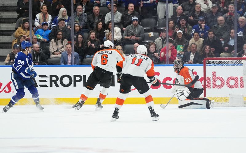 Feb 15, 2024; Toronto, Ontario, CAN; Toronto Maple Leafs right wing William Nylander (88) scores the winning goal against the Philadelphia Flyers during the overtime period at Scotiabank Arena. Mandatory Credit: Nick Turchiaro-USA TODAY Sports