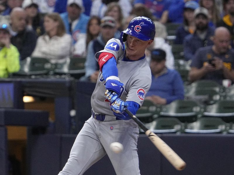 May 4, 2025; Milwaukee, Wisconsin, USA; Chicago Cubs outfielder Pete Crow-Armstrong (4) gets a hit against the Milwaukee Brewers in the fifth inning at American Family Field. Mandatory Credit: Michael McLoone-Imagn Images