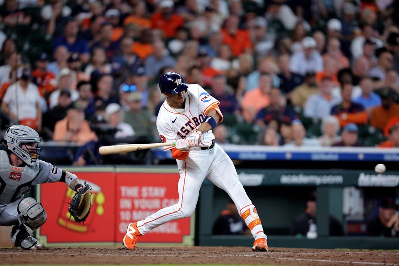 Apr 30, 2025; Houston, Texas, USA; Houston Astros shortstop Jeremy Pena (3) hits a single against the Detroit Tigers during the fifth inning at Daikin Park. Mandatory Credit: Erik Williams-Imagn Images