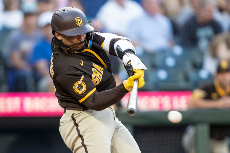 Aug 9, 2023; Seattle, Washington, USA; San Diego Padres catcher Luis Campusano (12) hits a single during the fifth inning against the Seattle Mariners at T-Mobile Park. Mandatory Credit: Stephen Brashear-USA TODAY Sports